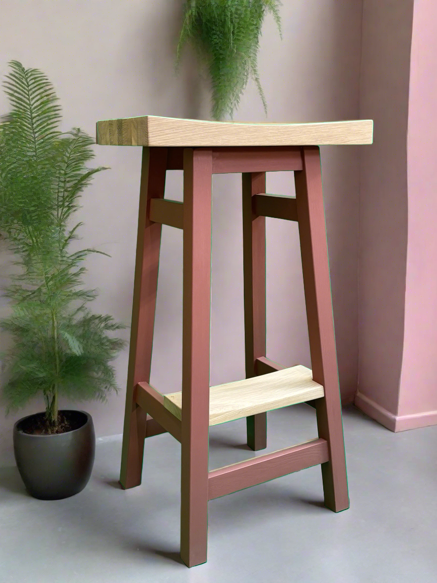 Tall kitchen stool with footrest and painted in a bright colour 